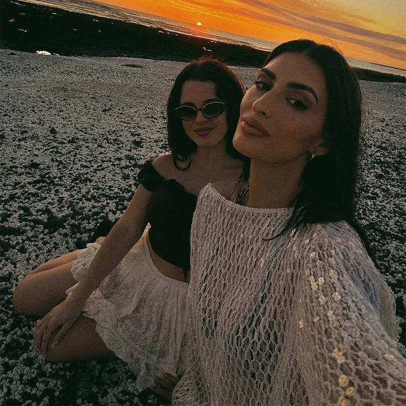 Sexy Solid Glitter Sequined Loose Short Tops Women See Through O Neck Long Sleeve Hollow Out Blouses 2026 Lady Beach Club Outfit