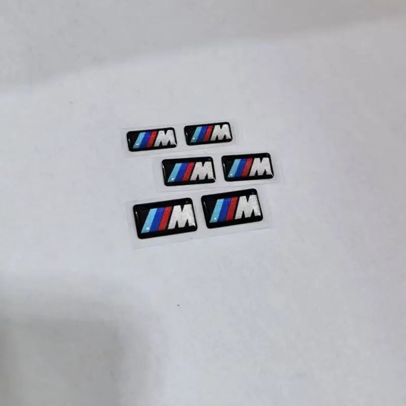 For BMW M Performance E84 E87 X5 E70 F25 E90 E91 F01 F02 E60 E61 F10 F15 F30 M3 M5 E64 4pc Car Sticker Steering Wheel Hub Decals