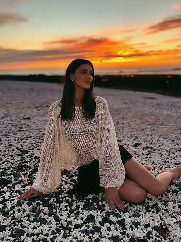 Sexy Solid Glitter Sequined Loose Short Tops Women See Through O Neck Long Sleeve Hollow Out Blouses 2026 Lady Beach Club Outfit
