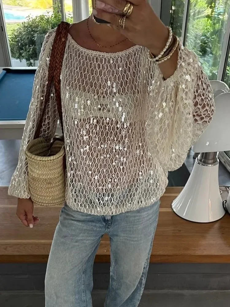 Sexy Solid Glitter Sequined Loose Short Tops Women See Through O Neck Long Sleeve Hollow Out Blouses 2026 Lady Beach Club Outfit