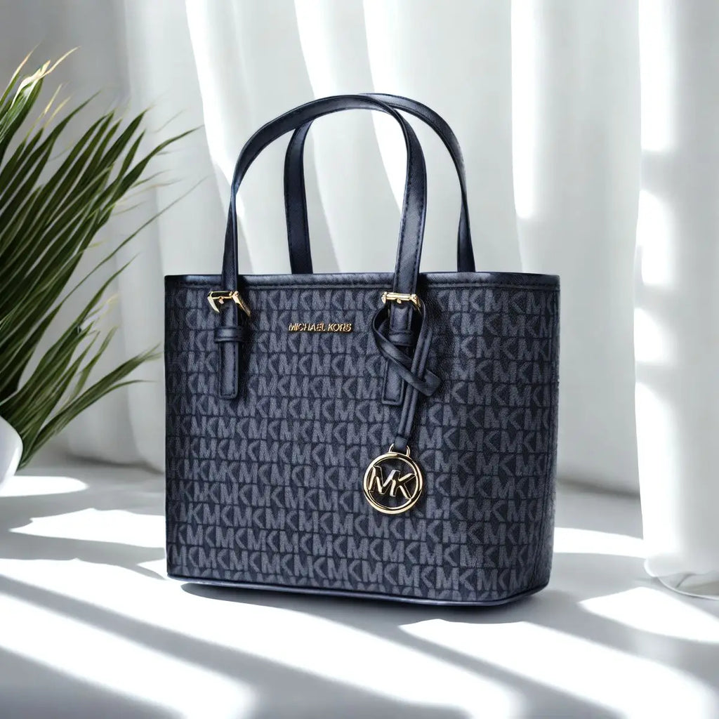 Sac fourre-tout porté main et croisé Michael Kors Ole Jet Set Travel Ultra Small en PVC imprimé avec cuir pour femme