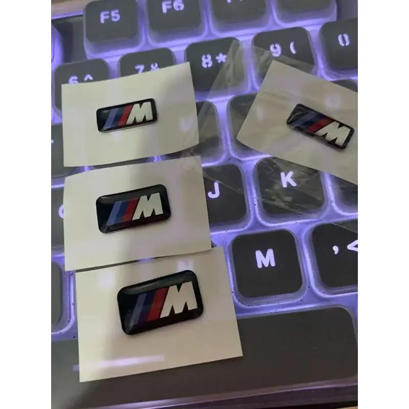 For BMW M Performance E84 E87 X5 E70 F25 E90 E91 F01 F02 E60 E61 F10 F15 F30 M3 M5 E64 4pc Car Sticker Steering Wheel Hub Decals